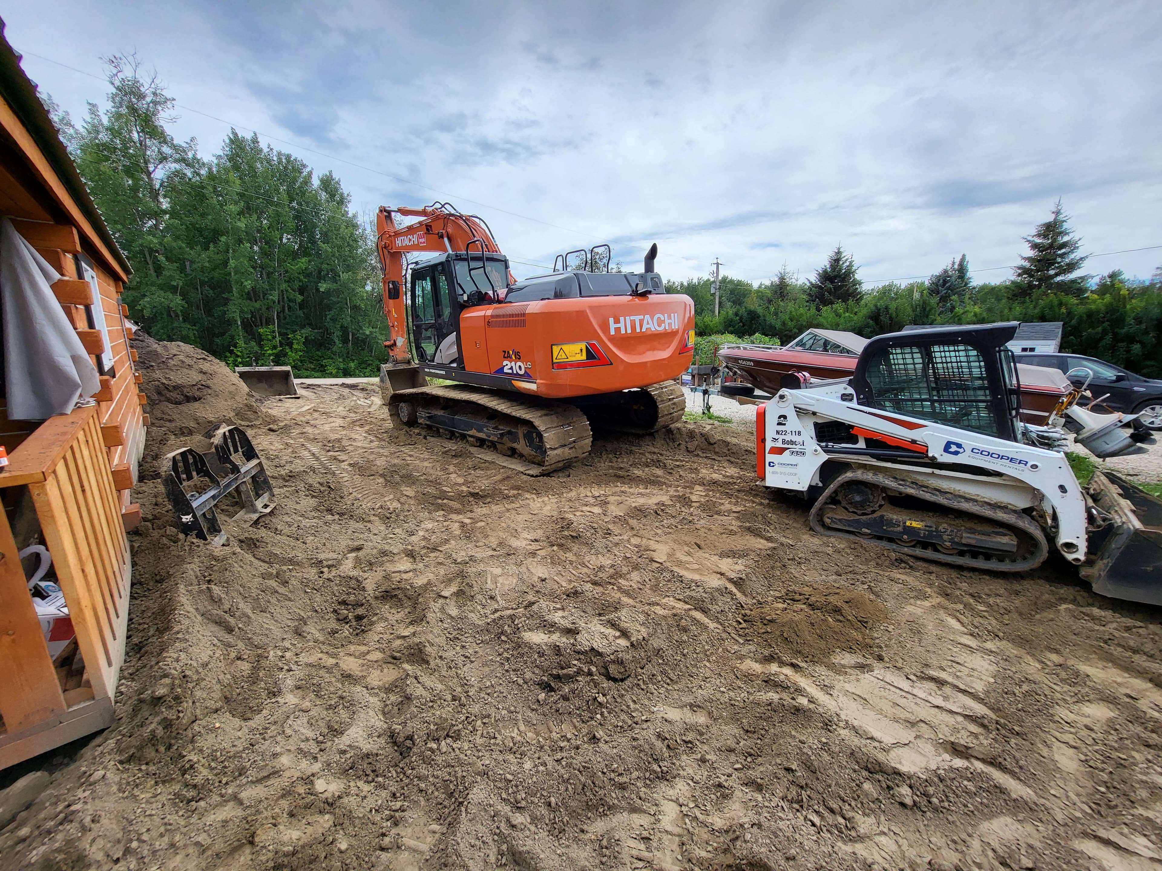 Excavator and track loader on residential project